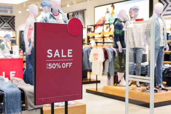 red sale sign in a department store