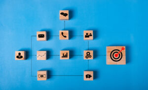 BUSINESS strategy and action PLAN.Chart with keywords and icons process for work target.Wood cube block stacking with icon step by step on blue background.