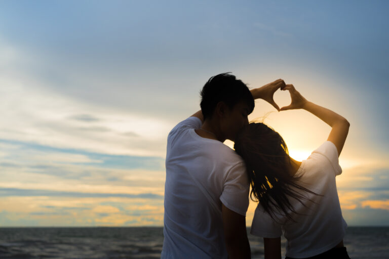 Young man and girl couple romantic dancing love leisure in celebration before married happy and fun at beach sunset vacation holidays, valentine day concept.