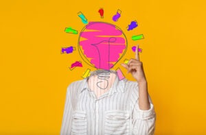 Creative ideas and innovations. Young lady with light bulb instead of her head pointing upwards, having aha moment