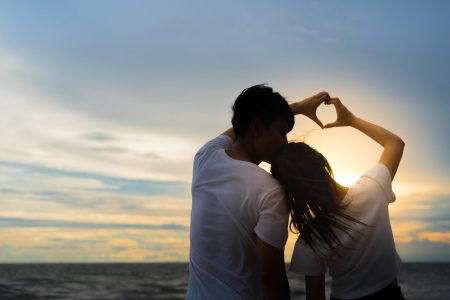 Young man and girl couple romantic dancing love leisure in celebration before married happy and fun at beach sunset vacation holidays, valentine day concept.