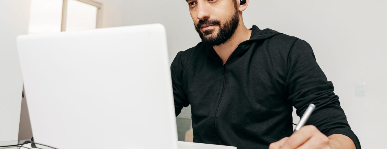 Designer working from home using laptop and tablet. Designer working from home using laptop and tablet.