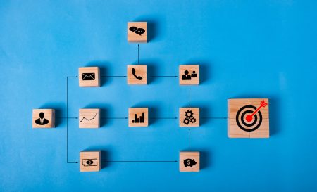 BUSINESS strategy and action PLAN.Chart with keywords and icons process for work target.Wood cube block stacking with icon step by step on blue background.