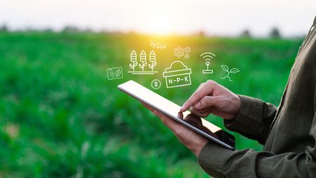 Farmers use agricultural technology in data analysis tablets and image icons. New technologies in agricultural business concepts. Men use tablets to research and develop plant varieties, agricultural