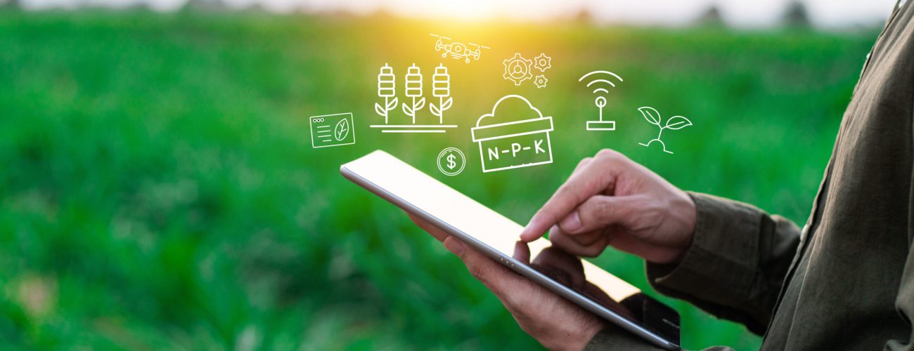 Farmers use agricultural technology in data analysis tablets and image icons. New technologies in agricultural business concepts. Men use tablets to research and develop plant varieties, agricultural