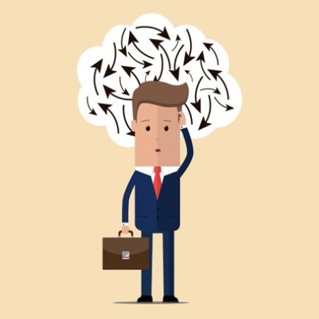 A confused looking animated man is wearing a blue suit and red tie. He is scratching his head with one hand and holding a briefcase in the other. Around is head is a white cloud with black arrows pointing in different directions.